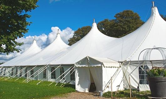 a line of sleek and modern portable toilets ready for use at an upscale corporate event in Cressona