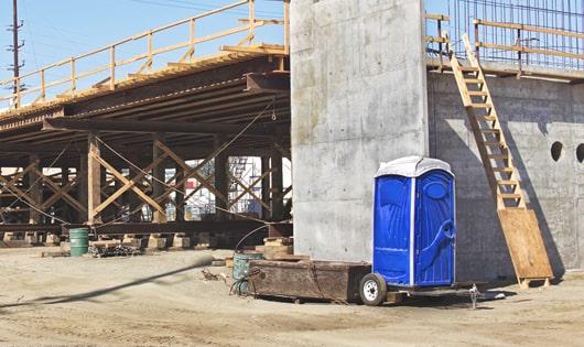 multiple portable restrooms arranged for easy access at a job site